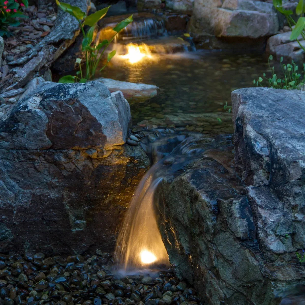 Aquascape Medium Deluxe Pondless Waterfall Kit with 16-foot stream and Aquasurge 2000-4000 adjustable flow pond pump.