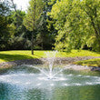 AirMax EcoSeries 1/2 HP floating fountain with control panel and 100-foot cord, designed for pond aeration and decorative water features.