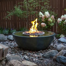 Aquascape Fire and Water Spillway Basin decorative feature with fire and water elements in a garden setting.